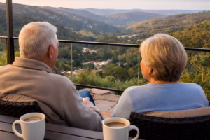 Senior couple enjoying a coffee and looking out over Roleystone